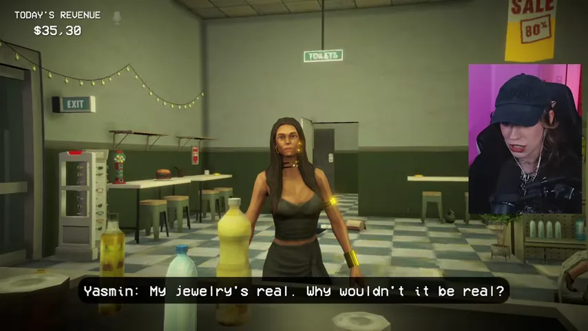 Yasmin points out her jewelry, creating the comparison used by the Anomaly Lens.