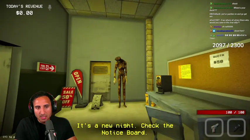The new corpse stands against the break-room wall beside the notice board.